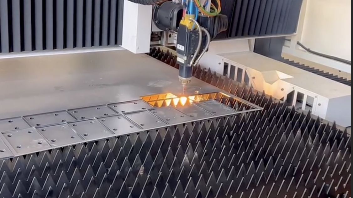 Wide view of the 12kW fiber sheet laser cutting a full-size steel blank